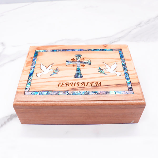 Beautiful olive wood box with mother of pearl cross and doves, engraved with "Jerusalem." Perfect for keepsakes or special gifts!