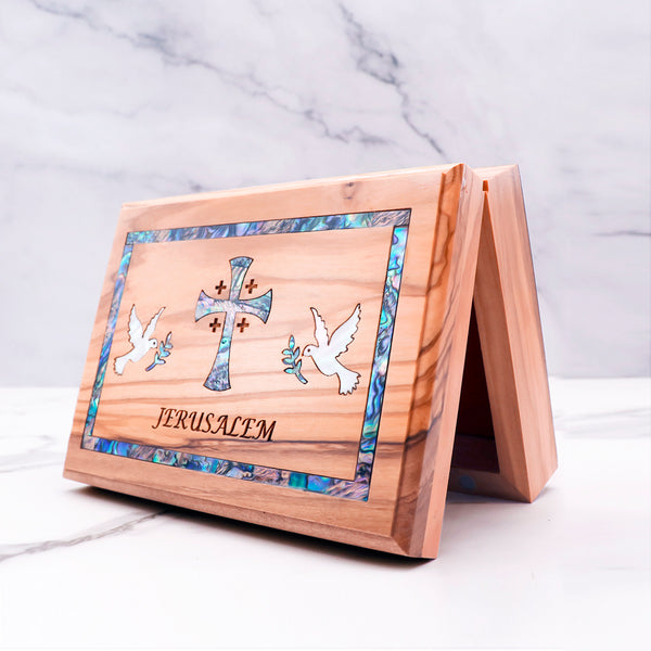 Beautiful olive wood box with mother of pearl cross and doves, engraved with "Jerusalem." Perfect for keepsakes or special gifts!