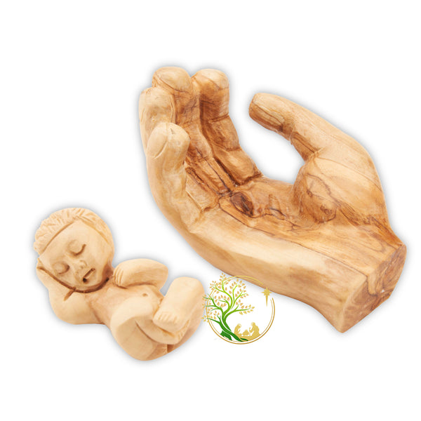 Baby Jesus figurine held in a wooden hand - Baby in Father's hand statue made in the Holy Land