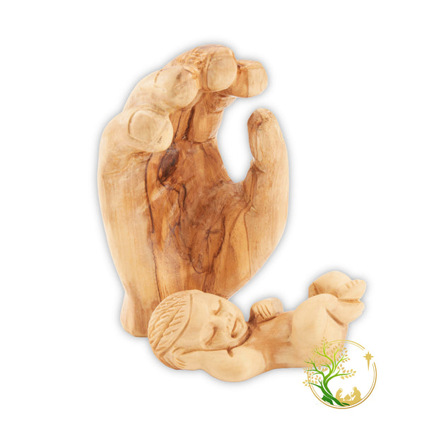 Baby Jesus figurine held in a wooden hand - Baby in Father's hand statue made in the Holy Land