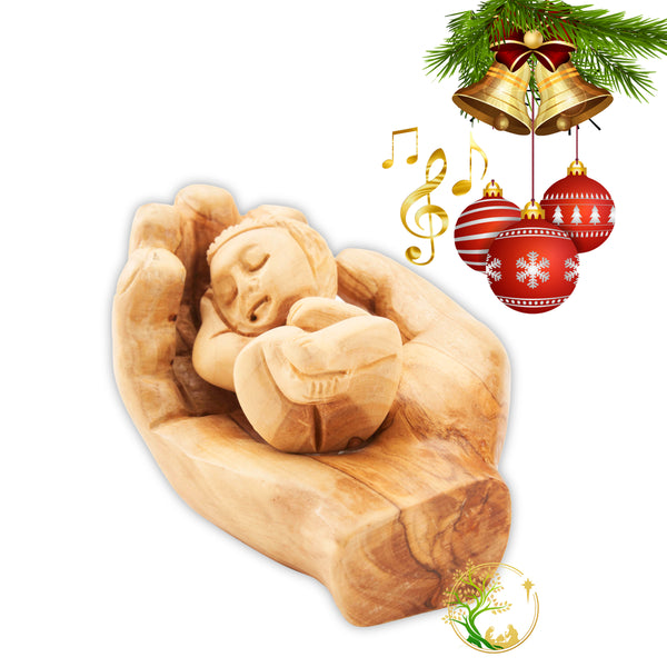 Baby Jesus figurine held in a wooden hand - Baby in Father's hand statue made in the Holy Land